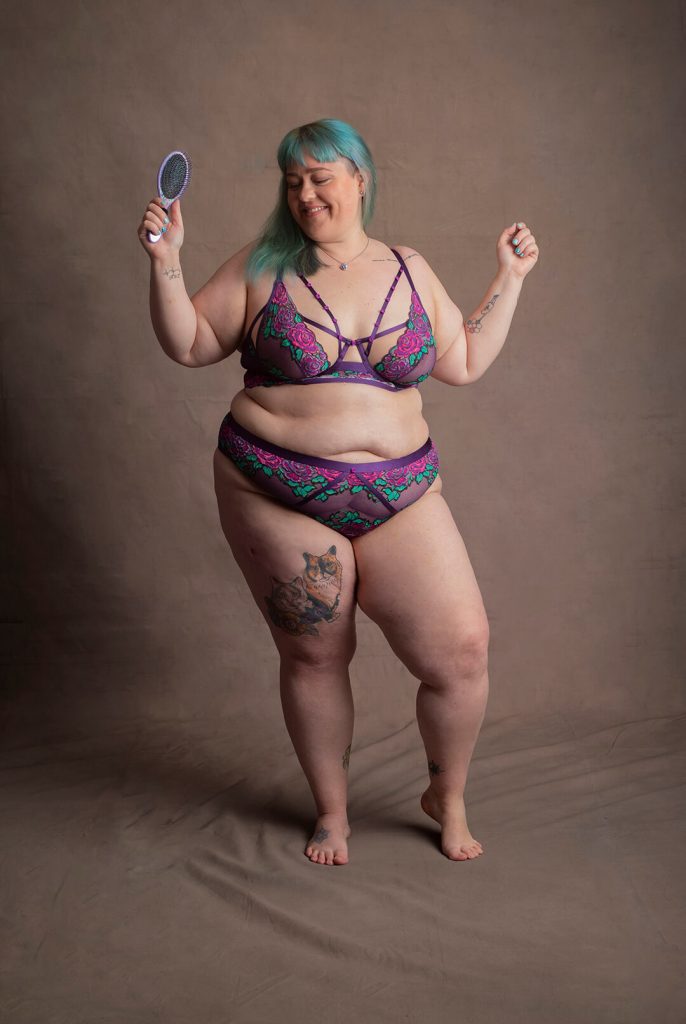 Laughing and dancing plus size person in underwear