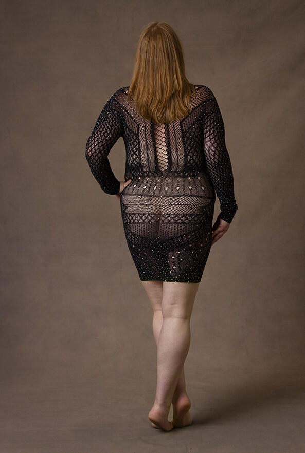 Coloured beautiful photograph of an empowered elegant lady in a black see through dress